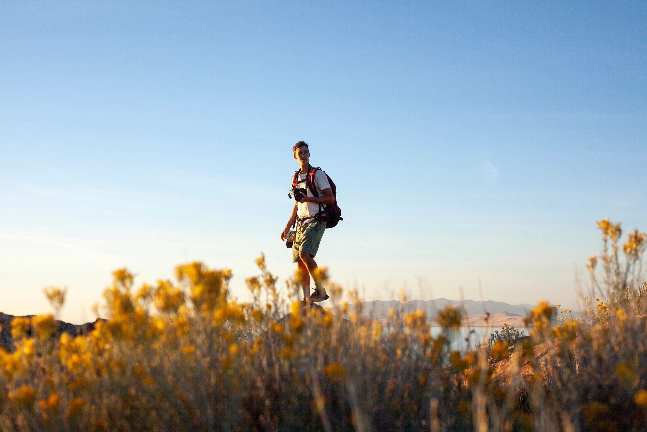 Outdoor travel photographer in a rugged landscape