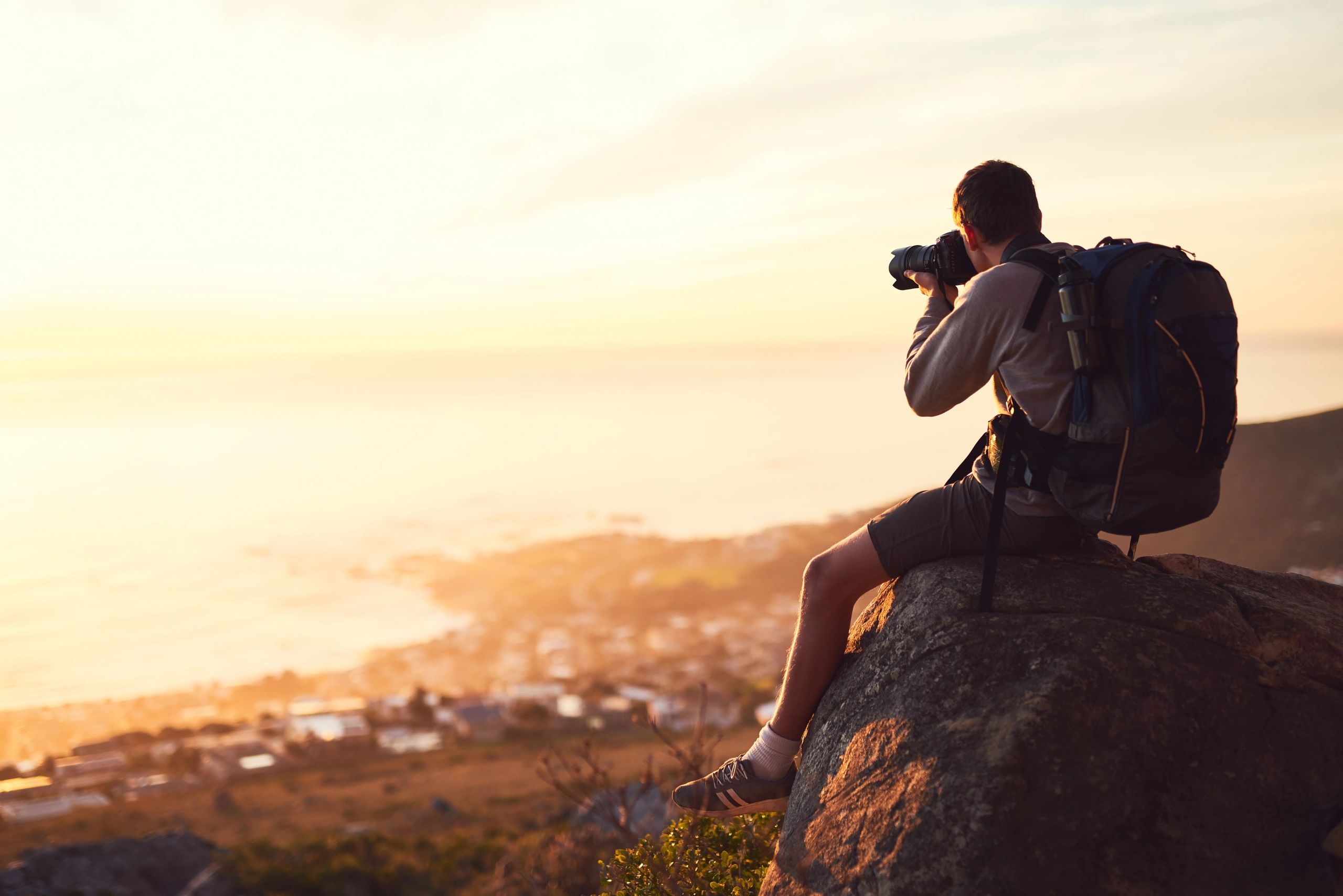 Outdoor photographer on a mountain viewpoint